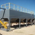 Semi trailer mounted low level box silo for cement or fly ash storage