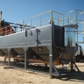 Semi trailer mounted low level box silo for cement or fly ash storage